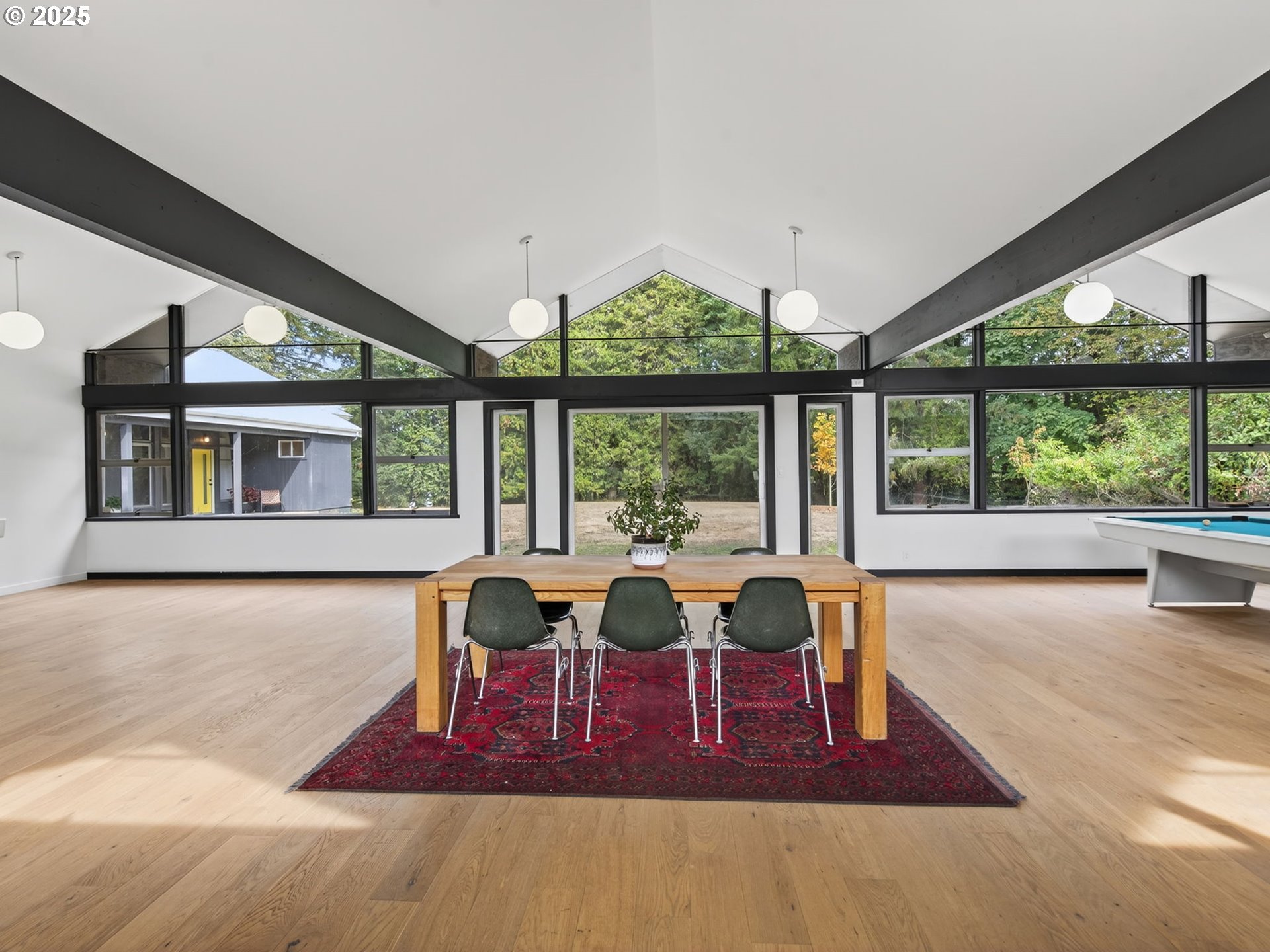 2590 Long Street Sweet Home, OR 97386 - Photo 45 of 48 a dining room with furniture large windows and wooden floor