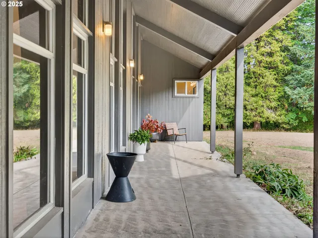 a view of a room that has a window and chair