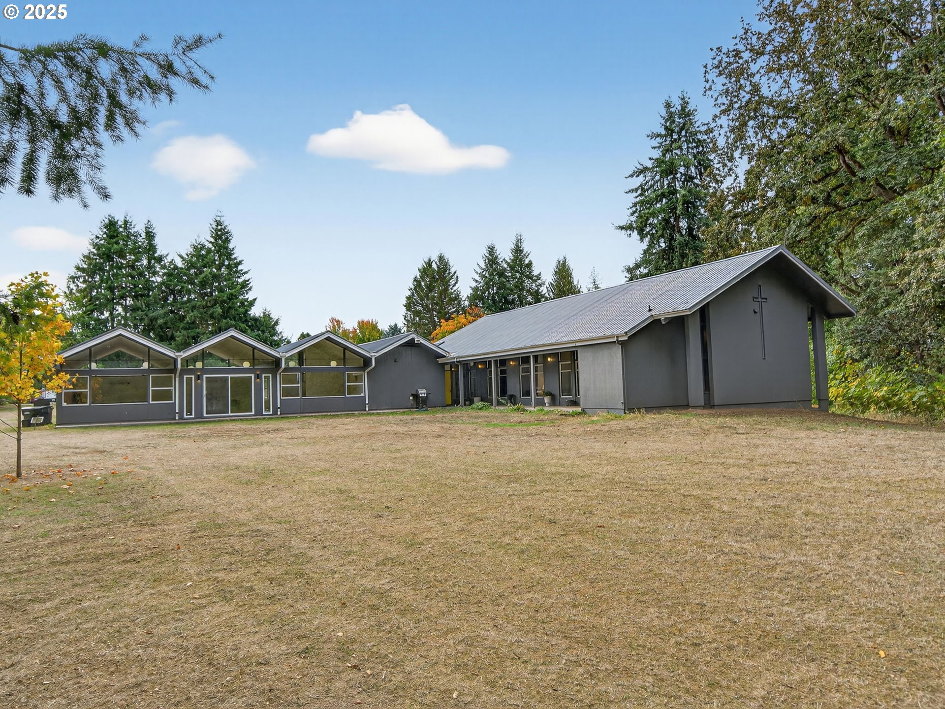 2590 Long Street Sweet Home, OR 97386 - Photo 7 of 48 a front view of a house with a garden and yard