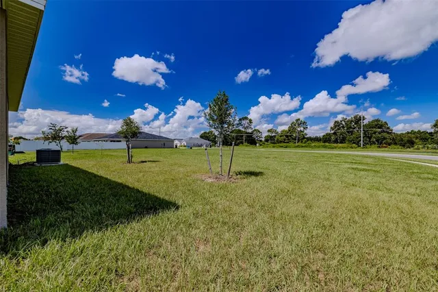 a view of a golf course with a yard
