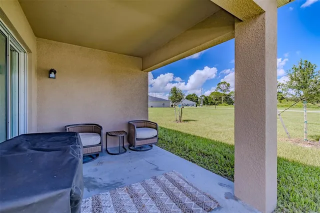 a view of two chairs in the room