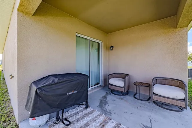 a room with a chair and gym equipment