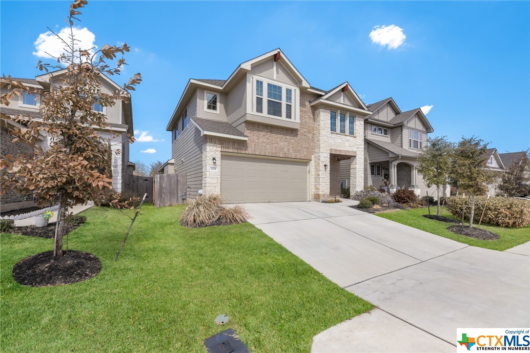 535 Stampede Road San Marcos, TX 78666 - Photo 1 of 1 a front view of a house with a yard