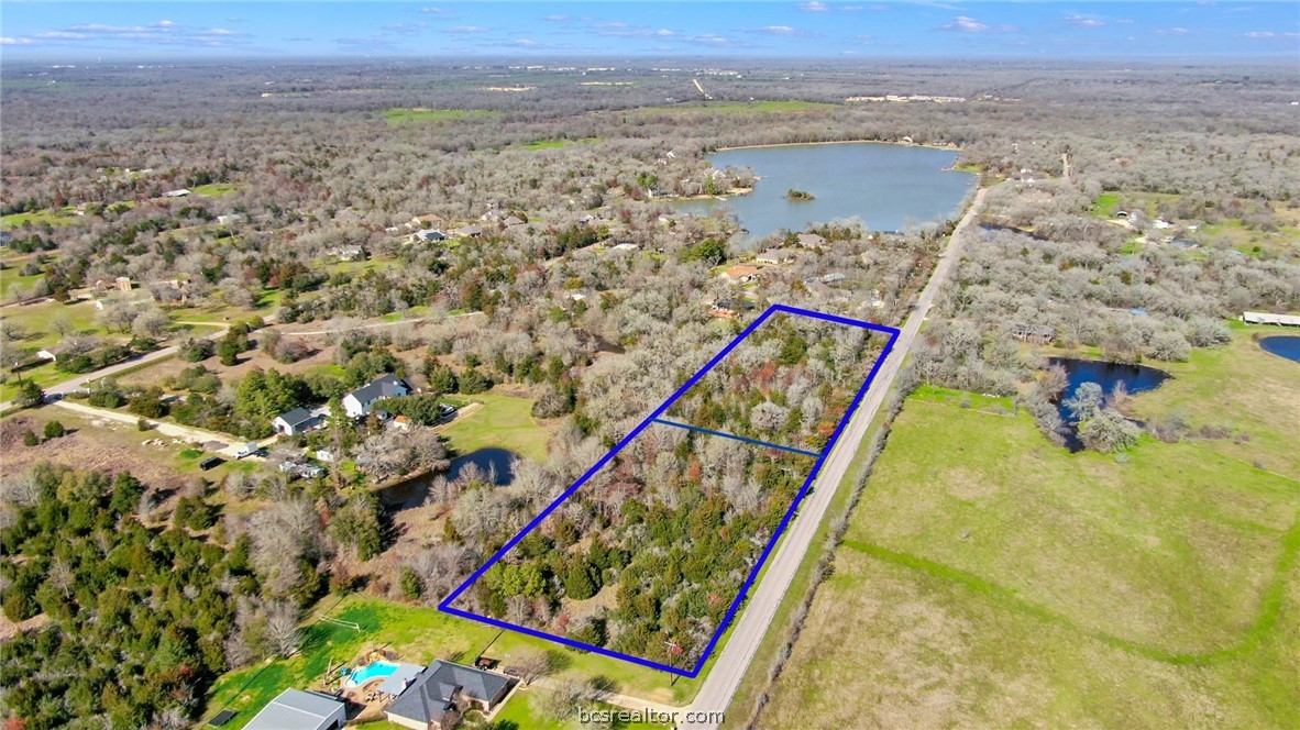 Lower tract is for sale - Aerial view of property's location - featuring a nearby body of water and property parcel outlined