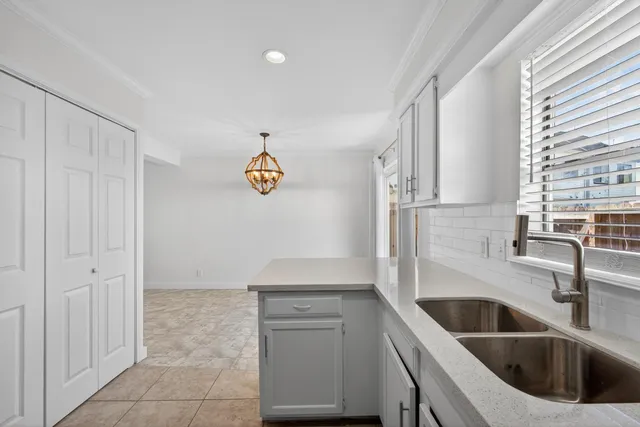 a kitchen with cabinets a sink and dishwasher
