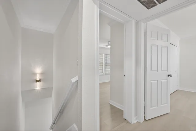 a view of a hallway with closet and entryway