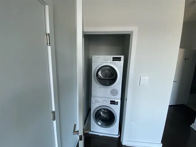 a view of a hallway with washer and dryer