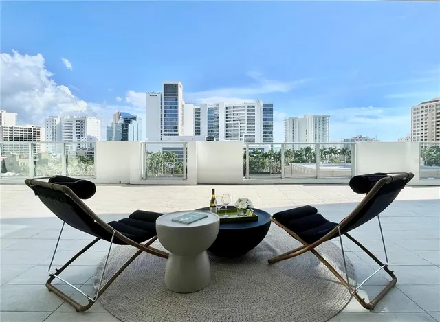 a view of a dining room with furniture and window