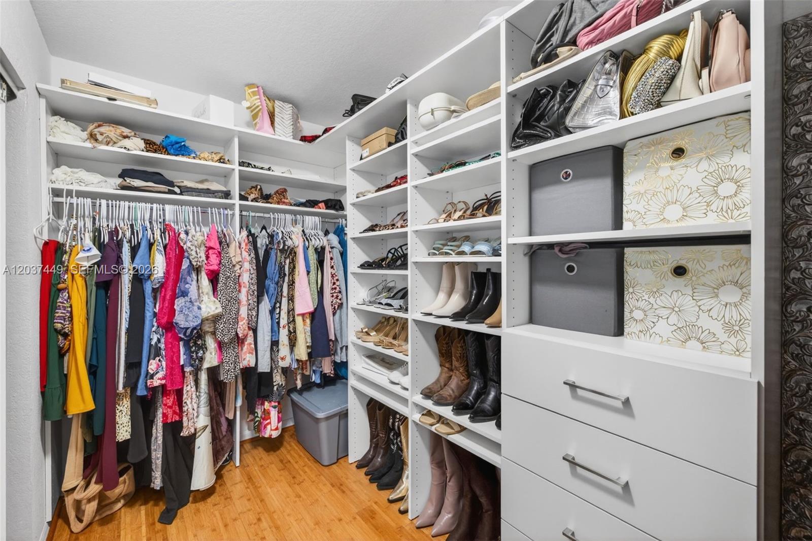 17488 Southwest 28th Court Miramar, FL 33029 - Photo 27 of 50 a view of walk in closet with clothes and shoes