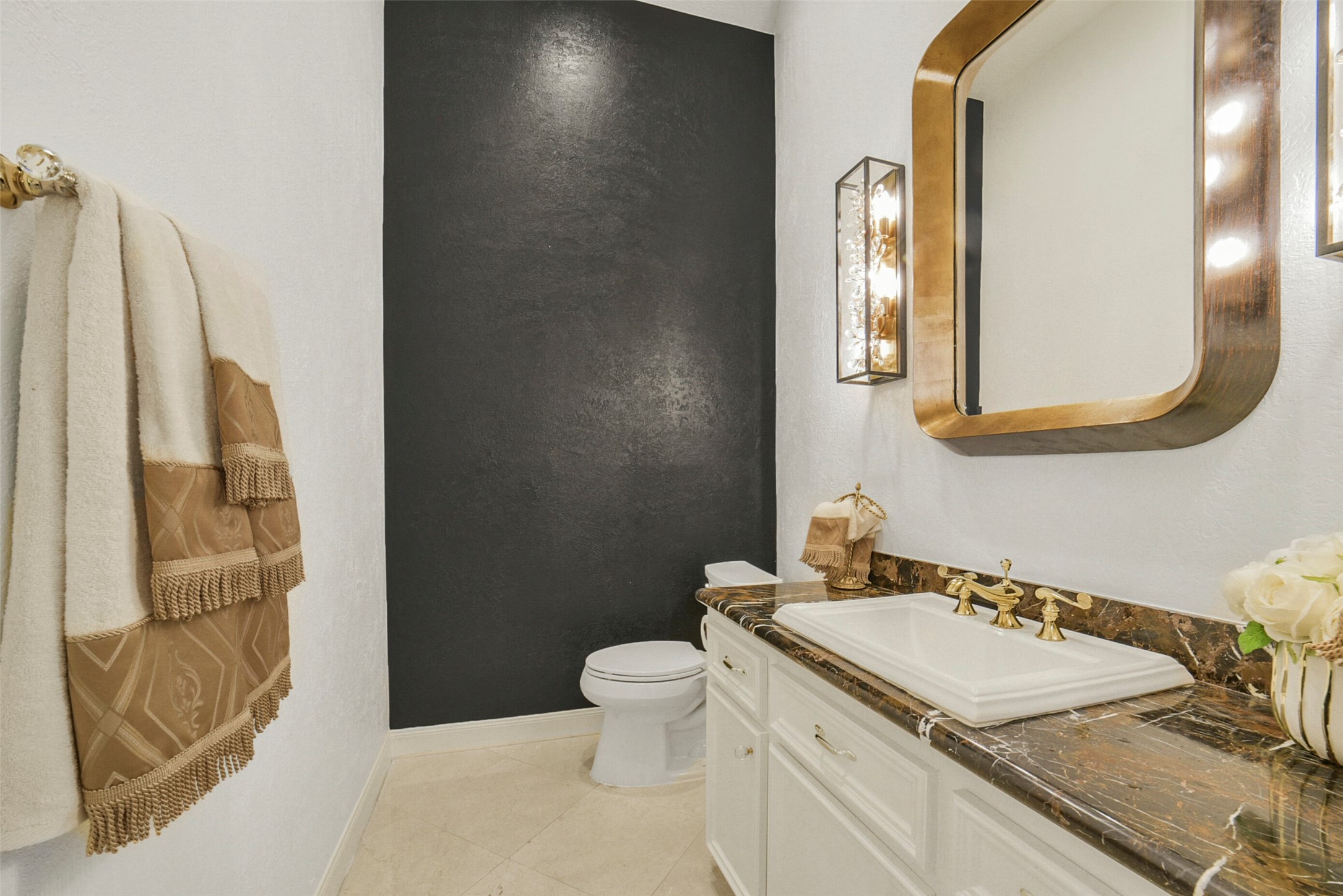 17302 Atherington Place Spring, TX 77379 - Photo 21 of 50 Updated Powder bath located near the office has beautiful gold fixtures and statement wall.