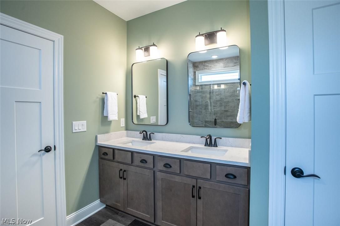 34286 Brookside Lane North Ridgeville, OH 44039 - Photo 24 of 50 Bathroom featuring double vanity and baseboards