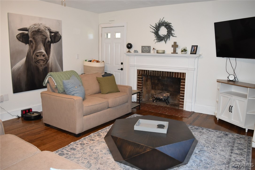 1118 West Osborn Road Farmville, VA 23901 - Photo 5 of 38 Living room featuring a fireplace and dark hardwoo