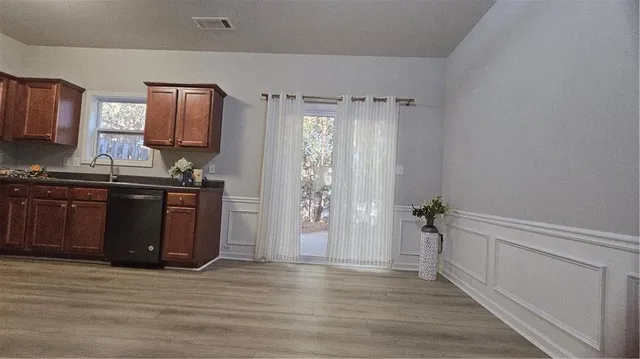 a view of a kitchen from the hallway