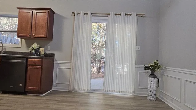 a bathroom with a shower a mirror and a sink