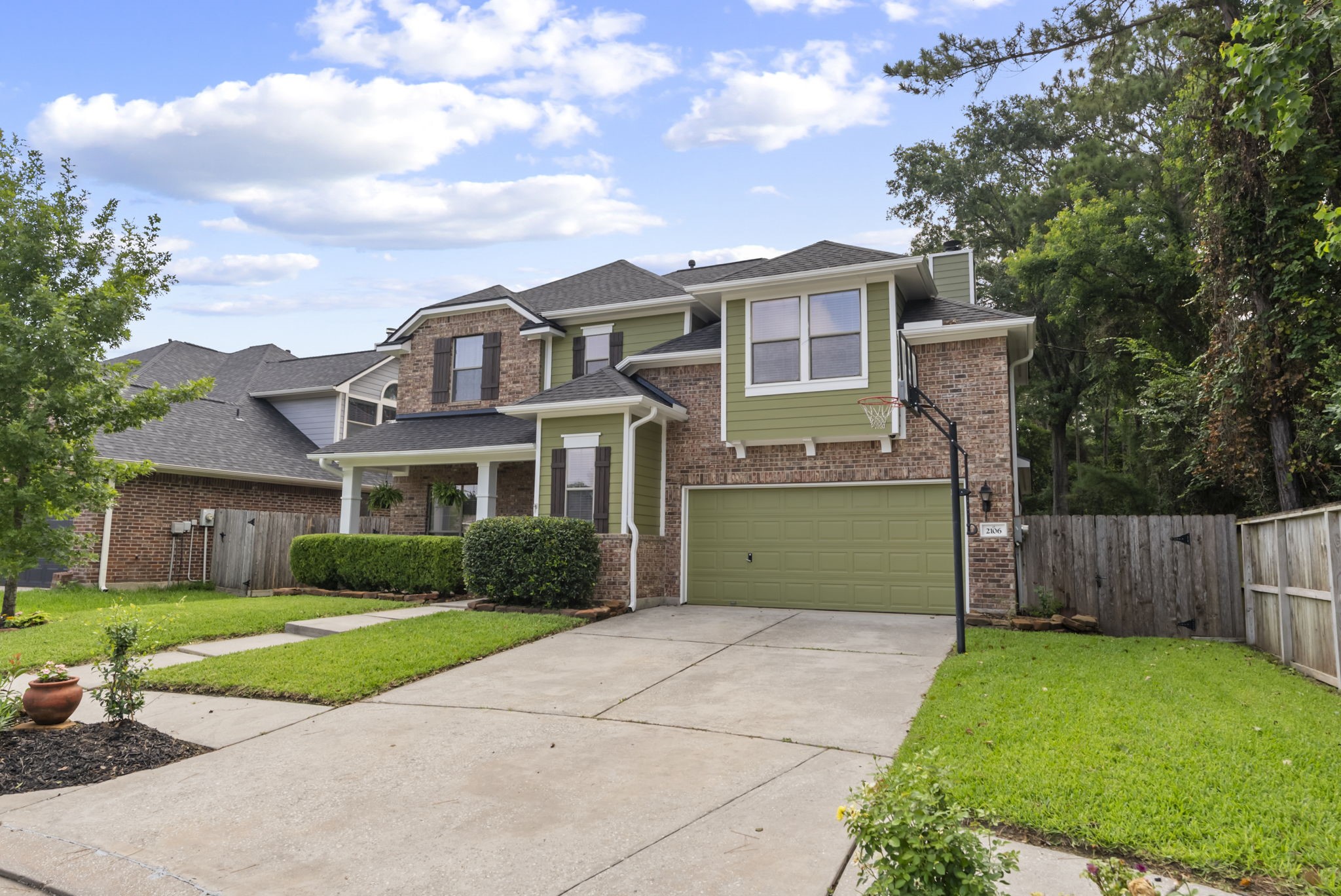 2106 Leaf Meadows Court Spring, TX 77386 - Photo 5 of 34 a front view of a house with a yard and garage