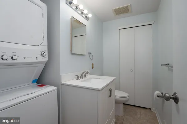 a bathroom with a sink toilet and vanity