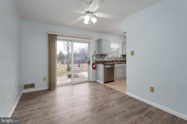 a kitchen with stainless steel appliances granite countertop a stove and a refrigerator