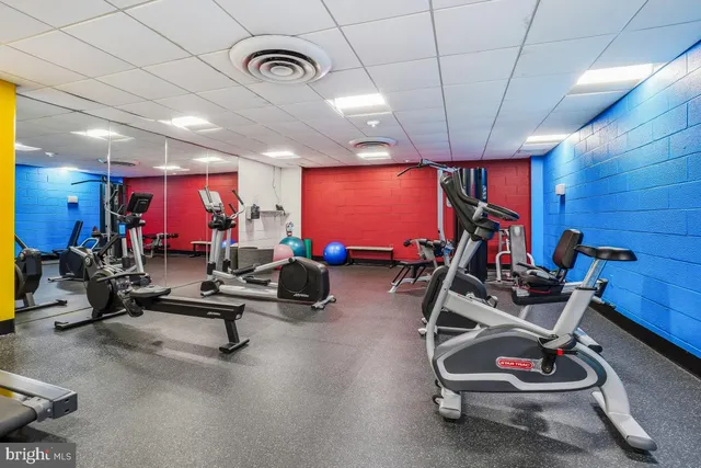 a room with gym equipment and gym equipment