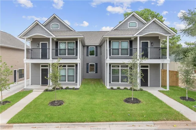 front view of a house with a yard