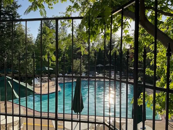 a view of swimming pool from a balcony