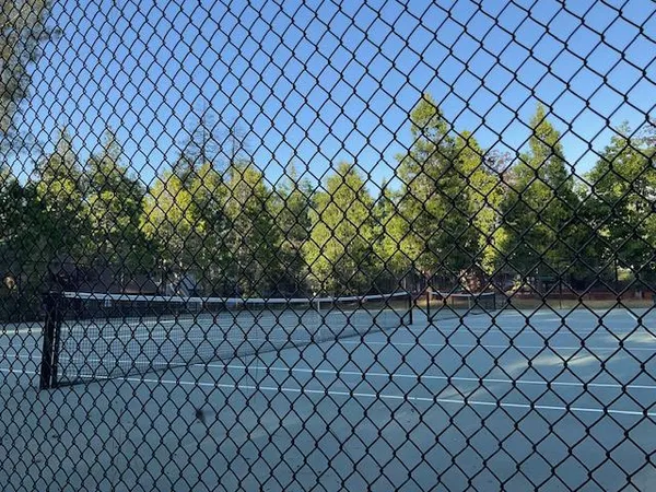 a view of a wall and fence