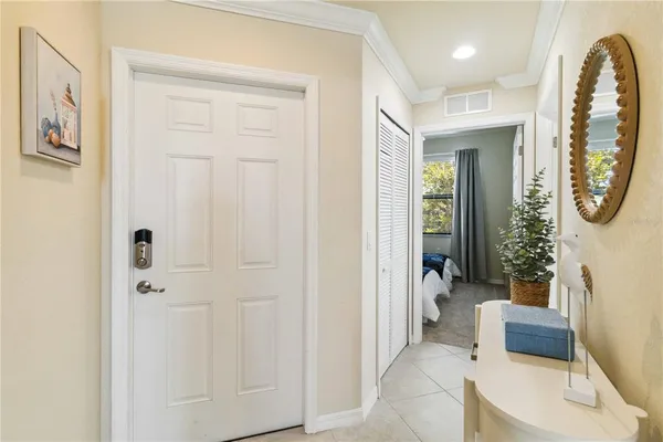 a living room with furniture a clock and a window