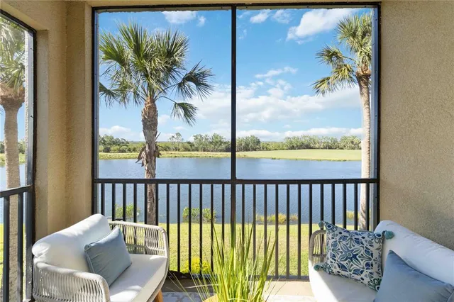 a view of a dining room with furniture and a chandelier