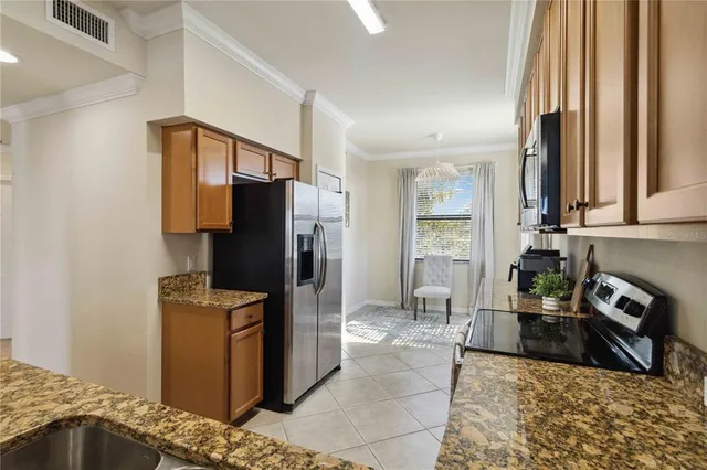 a kitchen with a stove a sink and a microwave