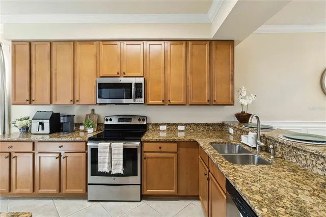 a kitchen with refrigerator and cabinets