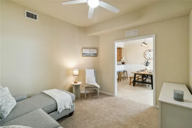 a spacious bedroom with a bed and a tv