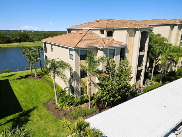 a aerial view of a house with a yard