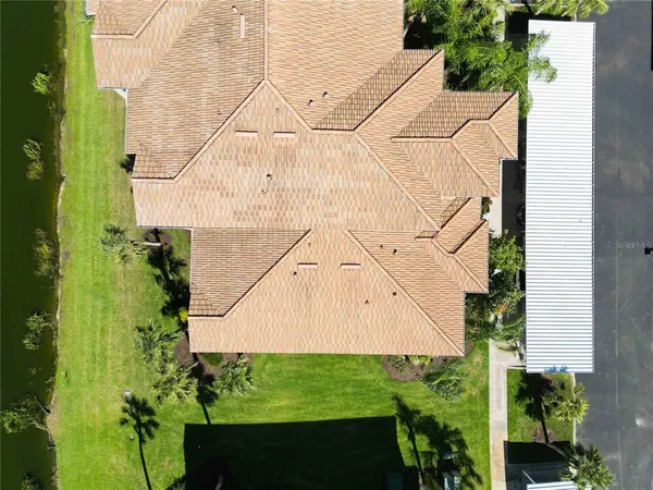 a aerial view of a houses with a yard