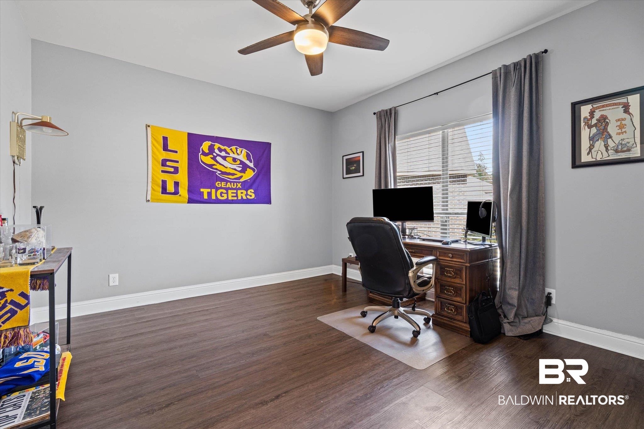 3739 Whitestone Drive Semmes, AL 36575 - Photo 6 of 25 Room with dark wood-finish flooring, light grey walls, and white baseboards