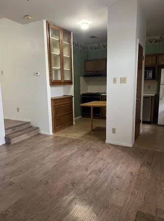 a kitchen with a stove and a cabinet