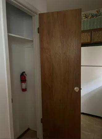 a kitchen with stainless steel appliances a stove a microwave a sink and cabinets