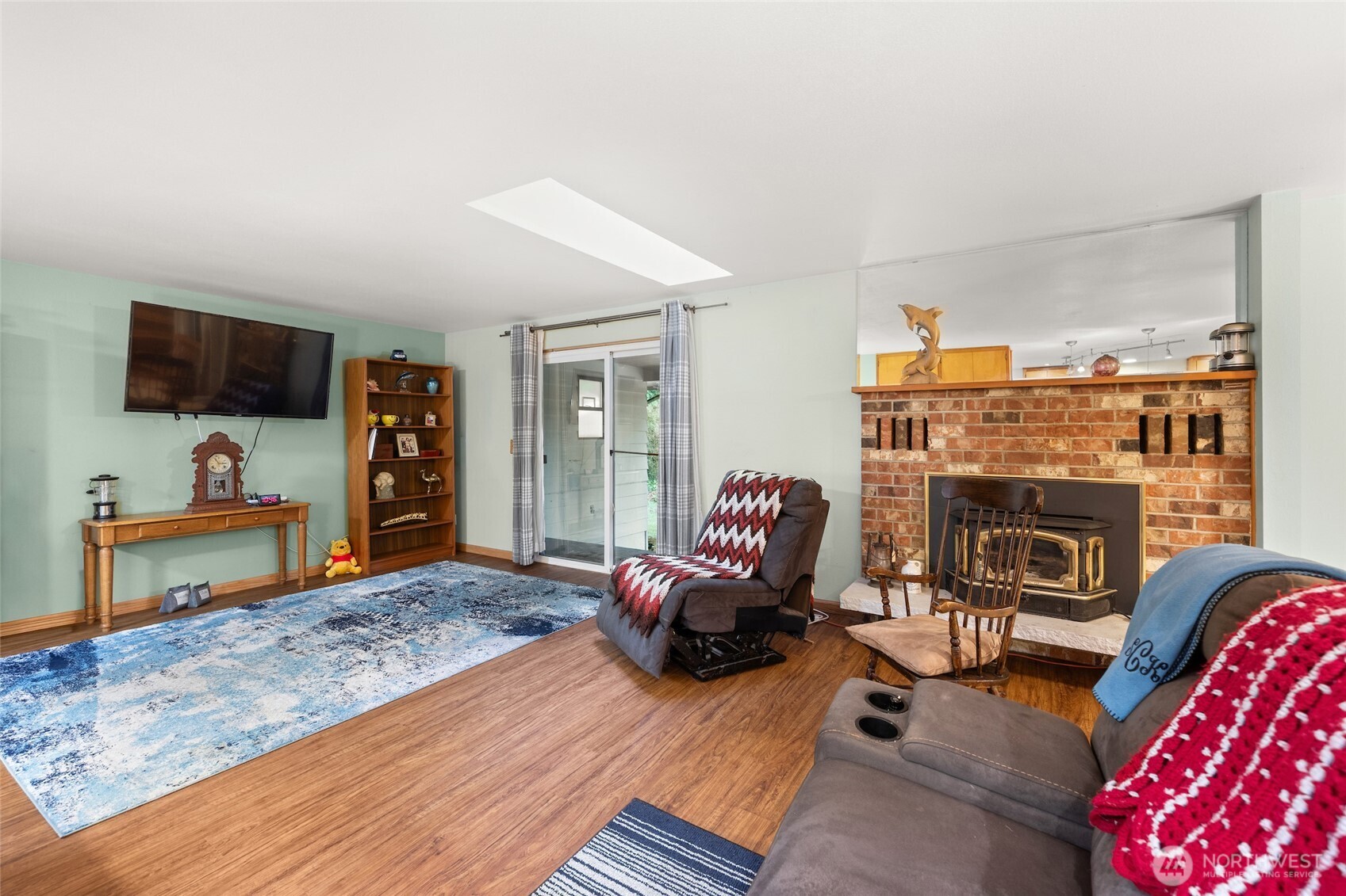 4617 200th Street Southeast Bothell, WA 98012 - Photo 15 of 39 a living room with furniture and a fireplace