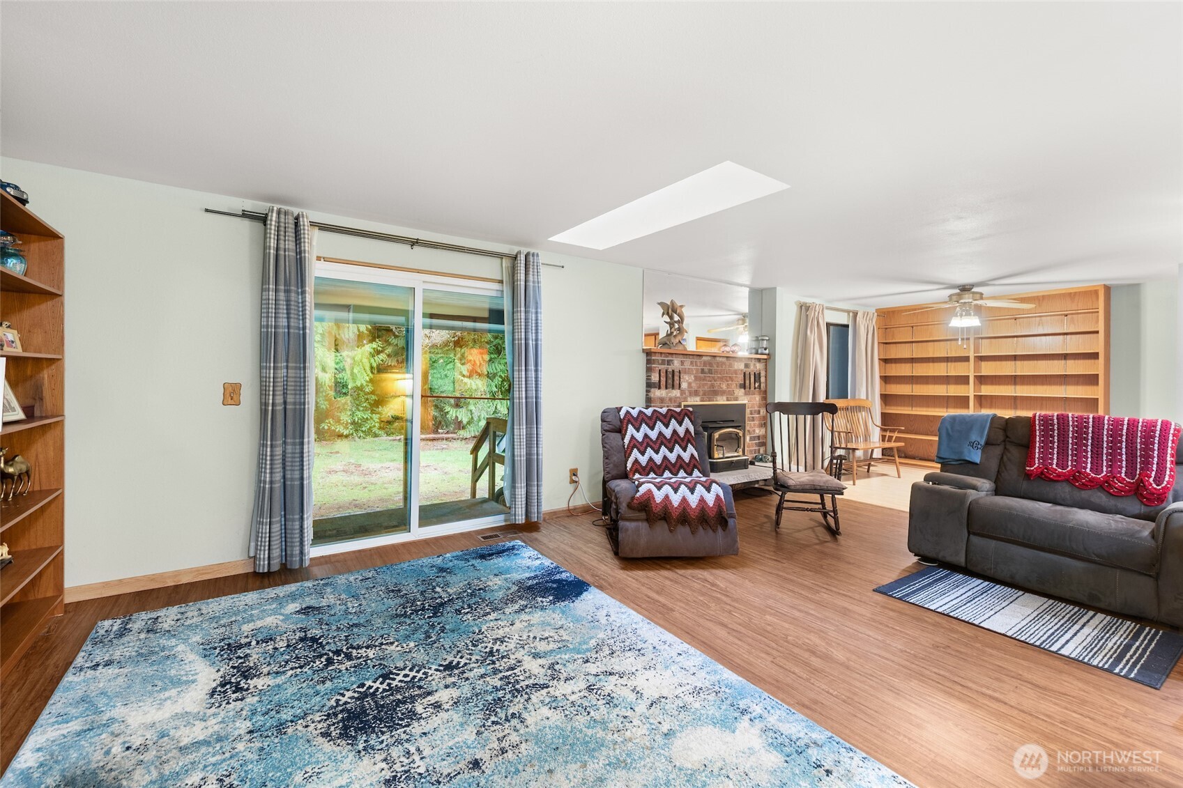 4617 200th Street Southeast Bothell, WA 98012 - Photo 16 of 39 a living room with furniture and a window
