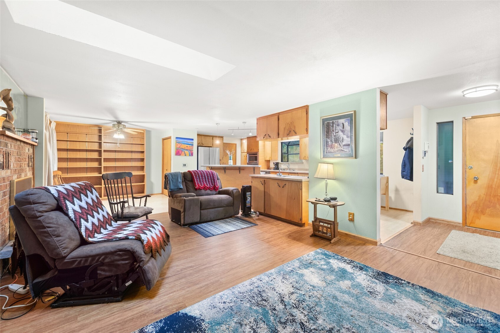 4617 200th Street Southeast Bothell, WA 98012 - Photo 17 of 39 a living room with furniture wooden floor and a large window