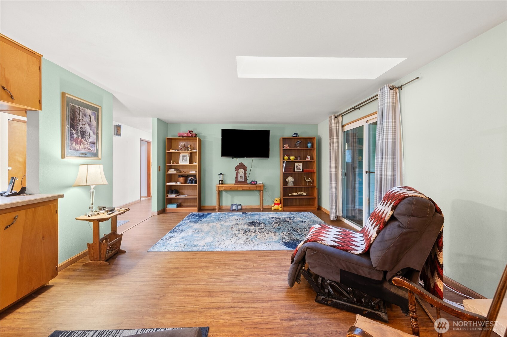 4617 200th Street Southeast Bothell, WA 98012 - Photo 19 of 39 a living room with furniture and a flat screen tv