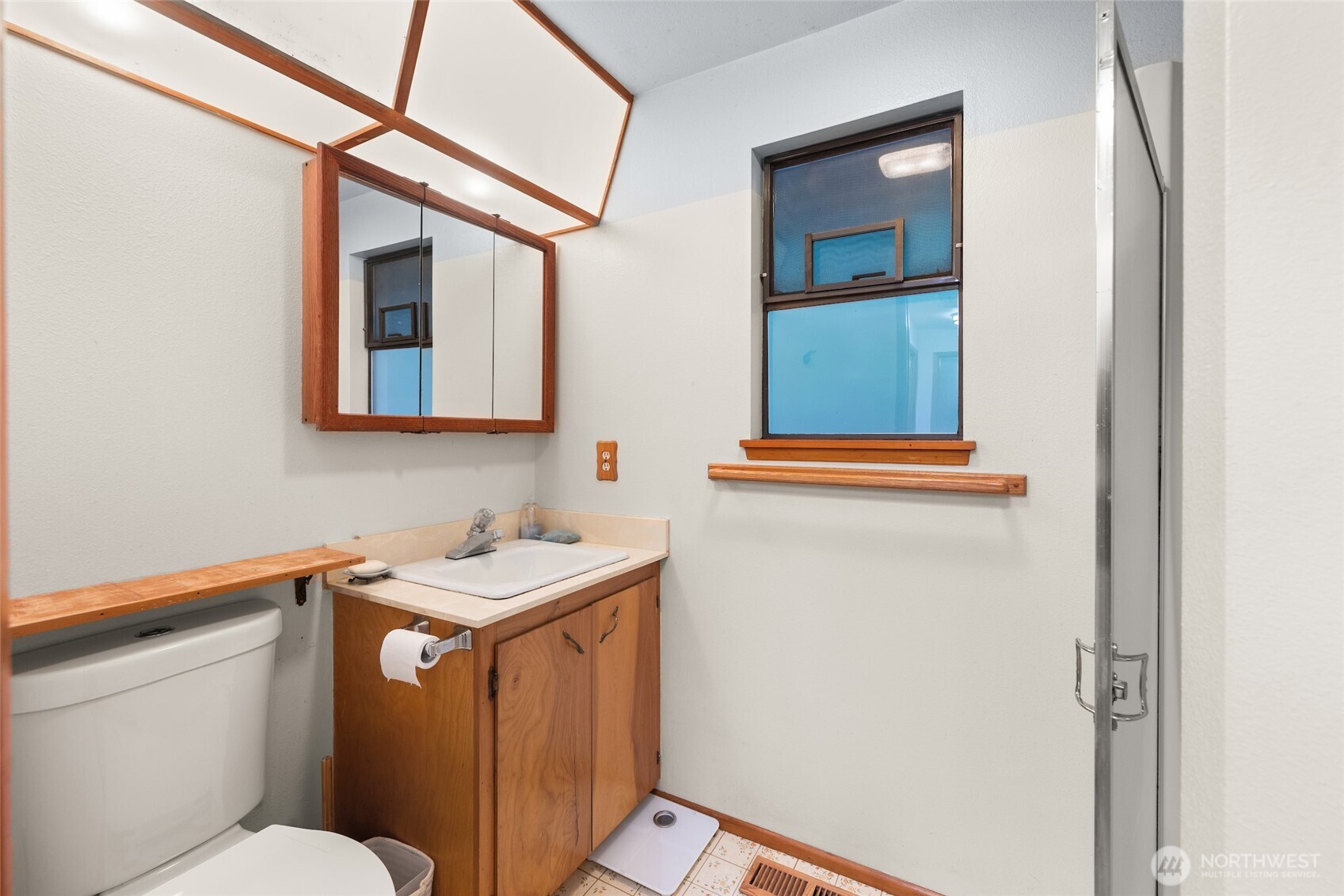 4617 200th Street Southeast Bothell, WA 98012 - Photo 20 of 39 a bathroom with a sink a toilet and mirror