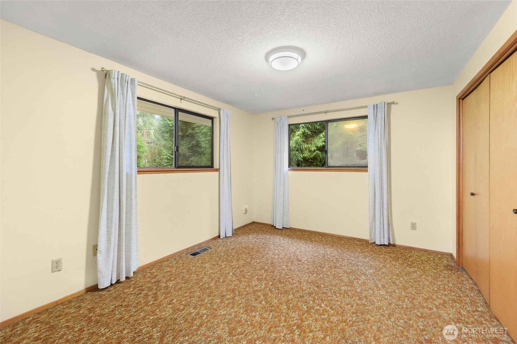 4617 200th Street Southeast Bothell, WA 98012 - Photo 21 of 39 an empty room with windows