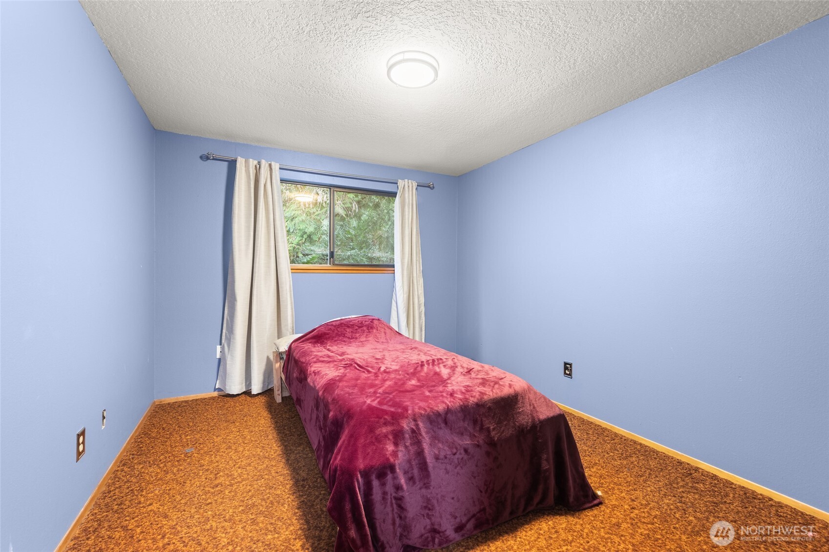 4617 200th Street Southeast Bothell, WA 98012 - Photo 24 of 39 a bed room with a bed and a window