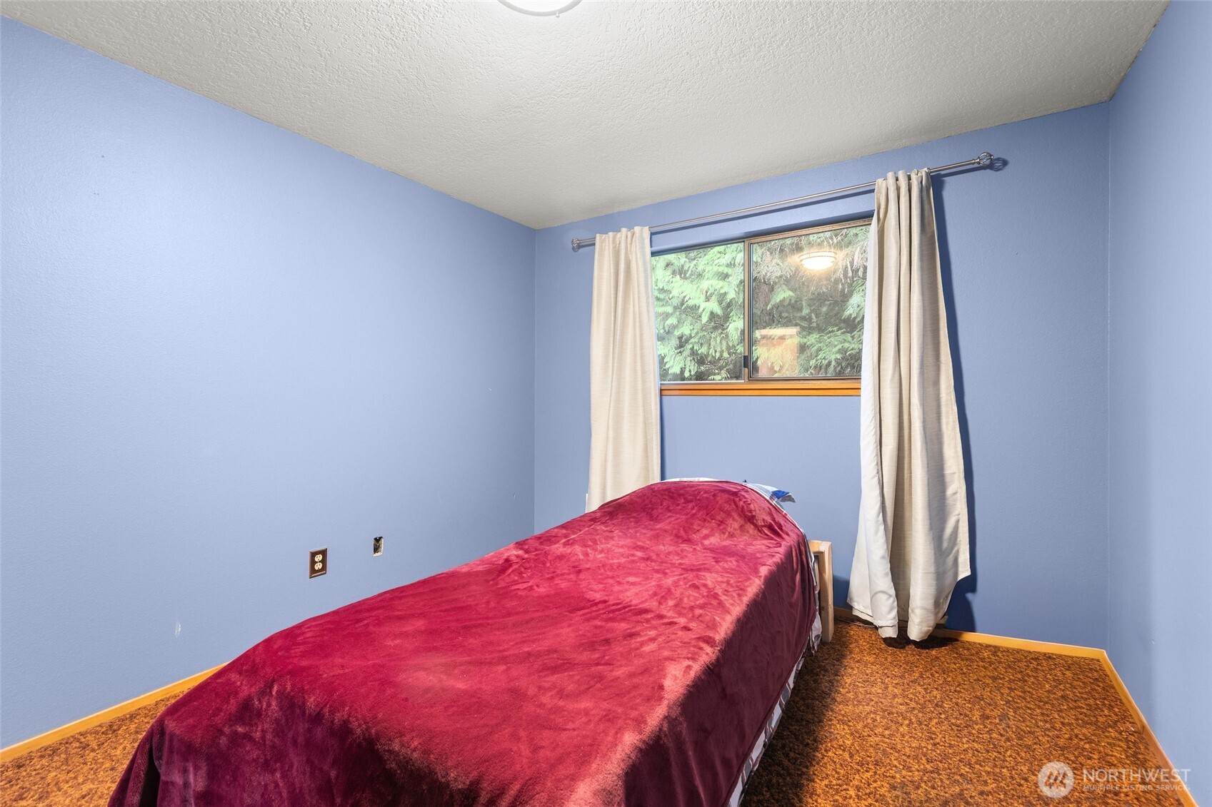 4617 200th Street Southeast Bothell, WA 98012 - Photo 25 of 39 a bedroom with a bed and a window