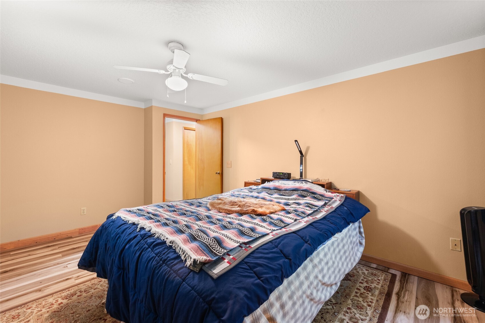 4617 200th Street Southeast Bothell, WA 98012 - Photo 27 of 39 a bedroom with a bed and a chandelier