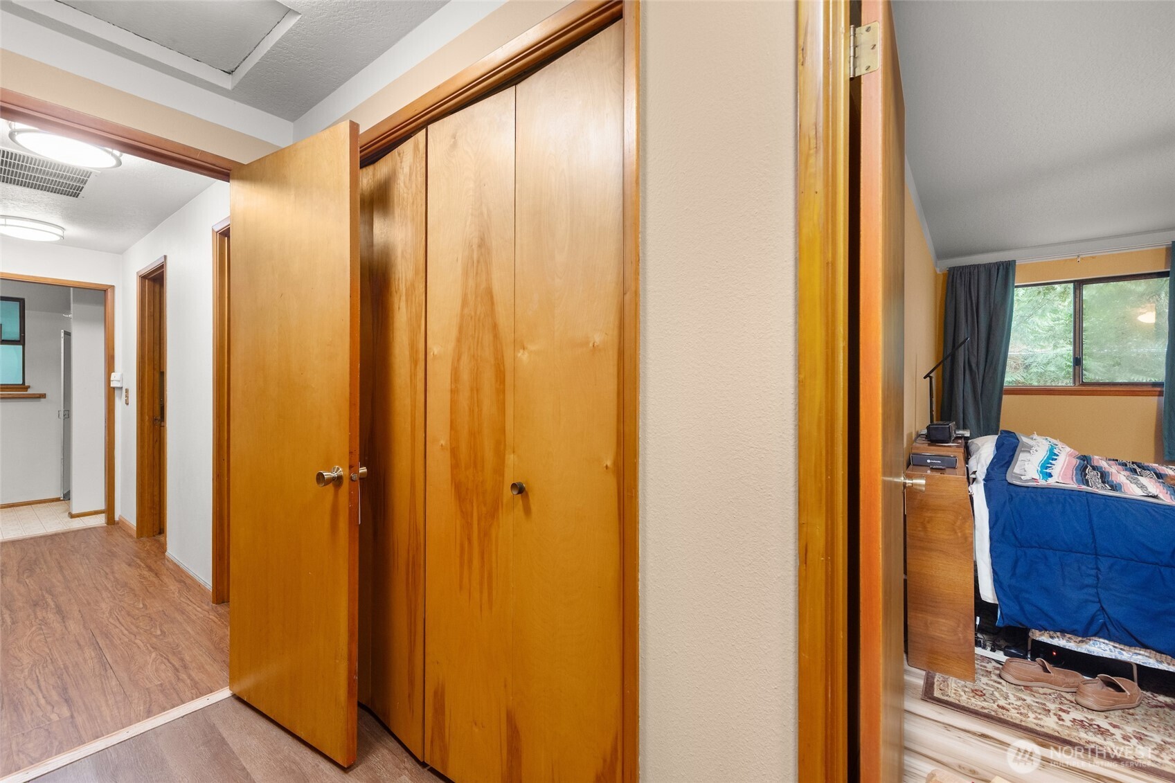 4617 200th Street Southeast Bothell, WA 98012 - Photo 31 of 39 a view of a hallway with bathroom and wooden floor
