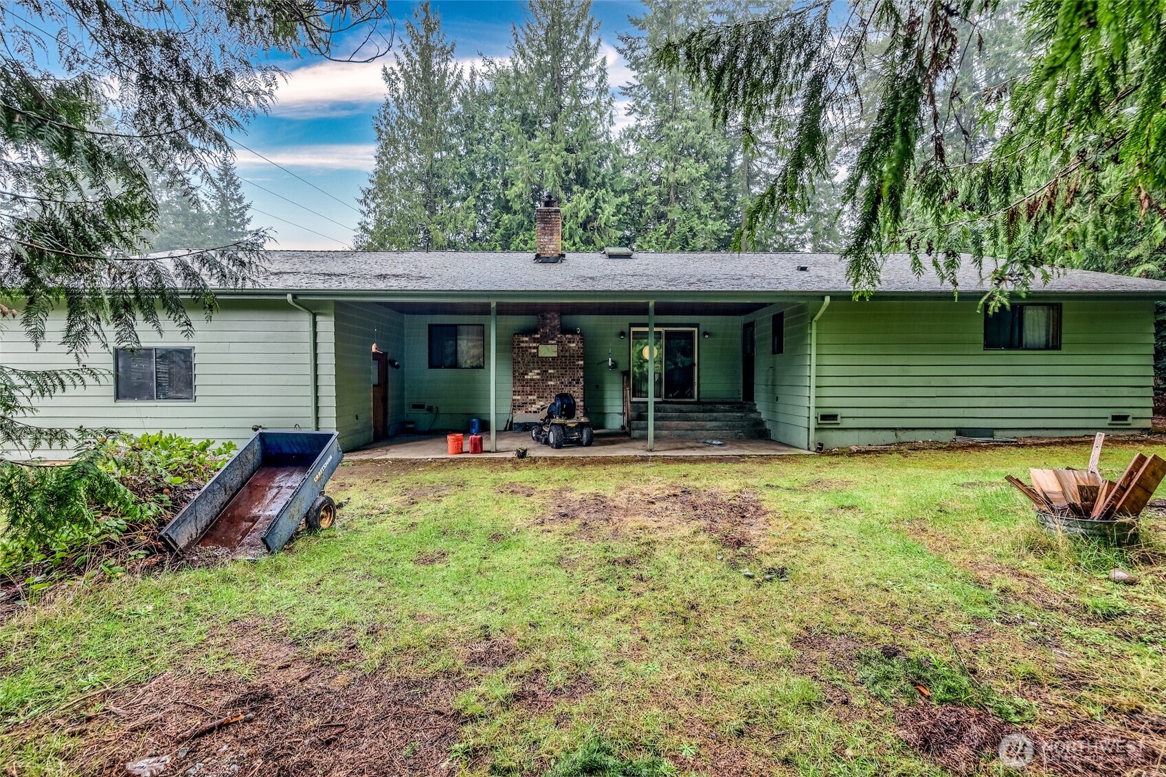 4617 200th Street Southeast Bothell, WA 98012 - Photo 33 of 39 a view of a house with backyard and sitting area