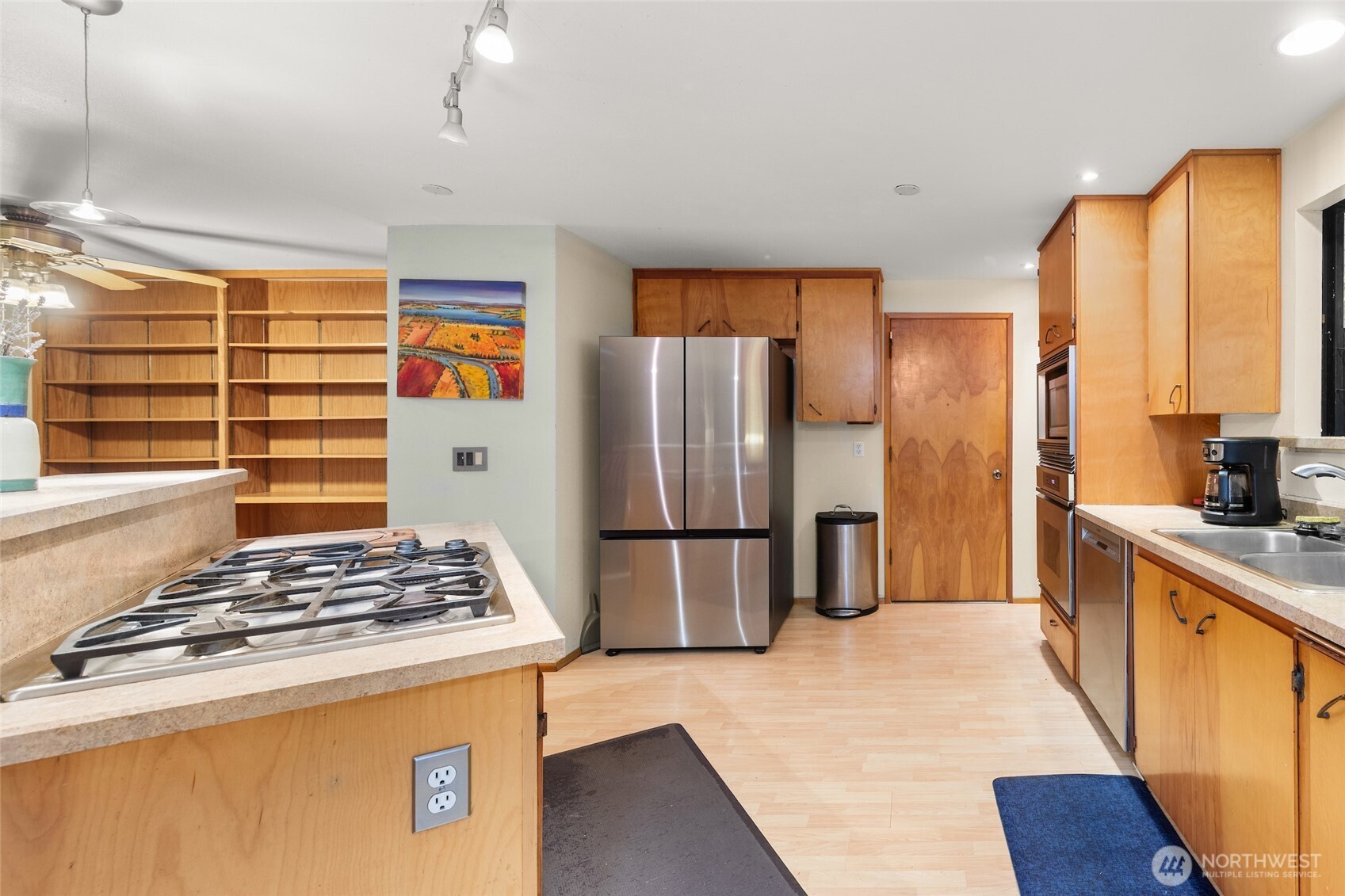 4617 200th Street Southeast Bothell, WA 98012 - Photo 9 of 39 a kitchen with stainless steel appliances granite countertop a refrigerator and a stove top oven