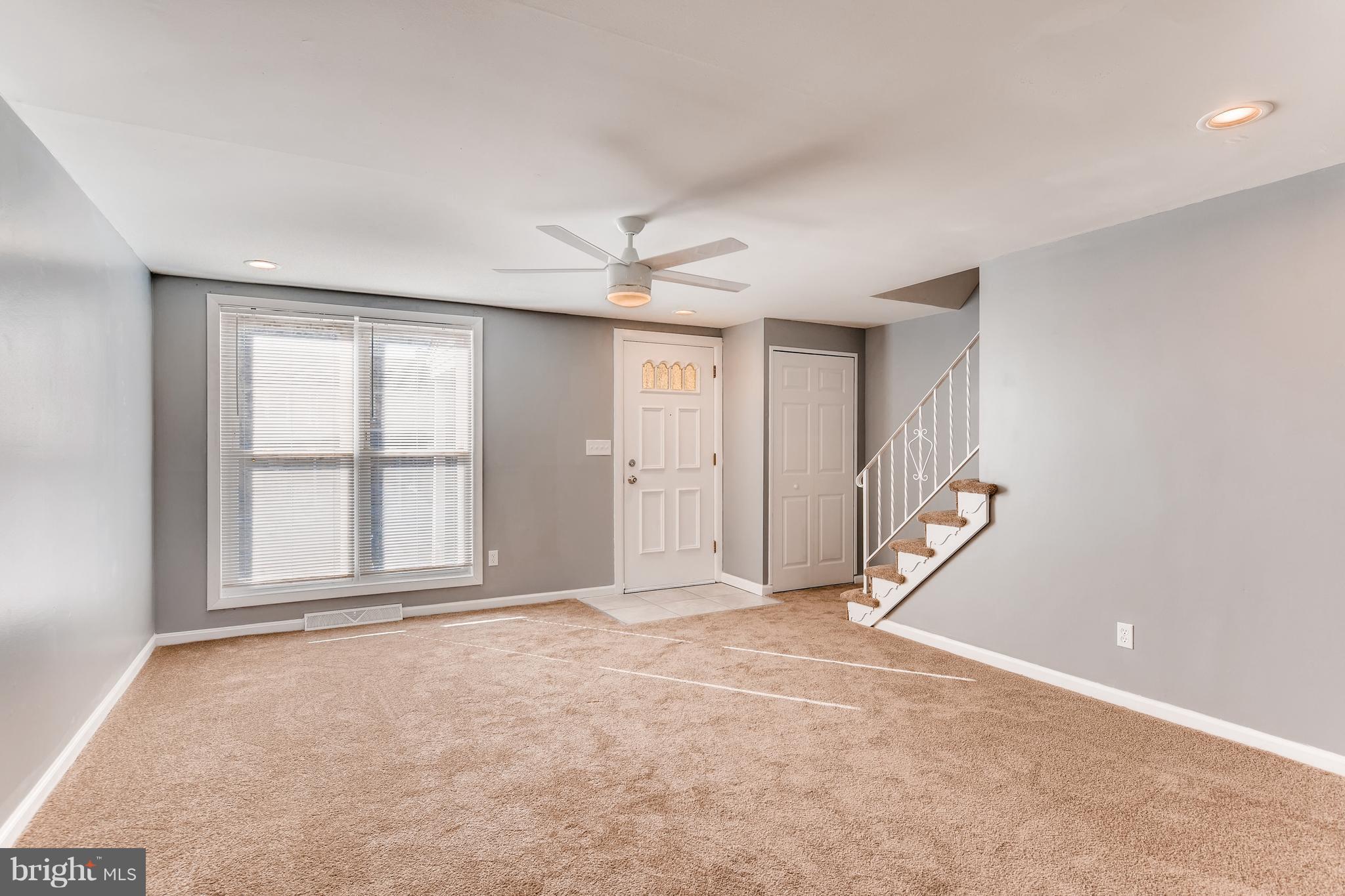 5505 Silverbell Road Baltimore, MD 21206 - Photo 2 of 21 Living room with coat closet and w/w carpet