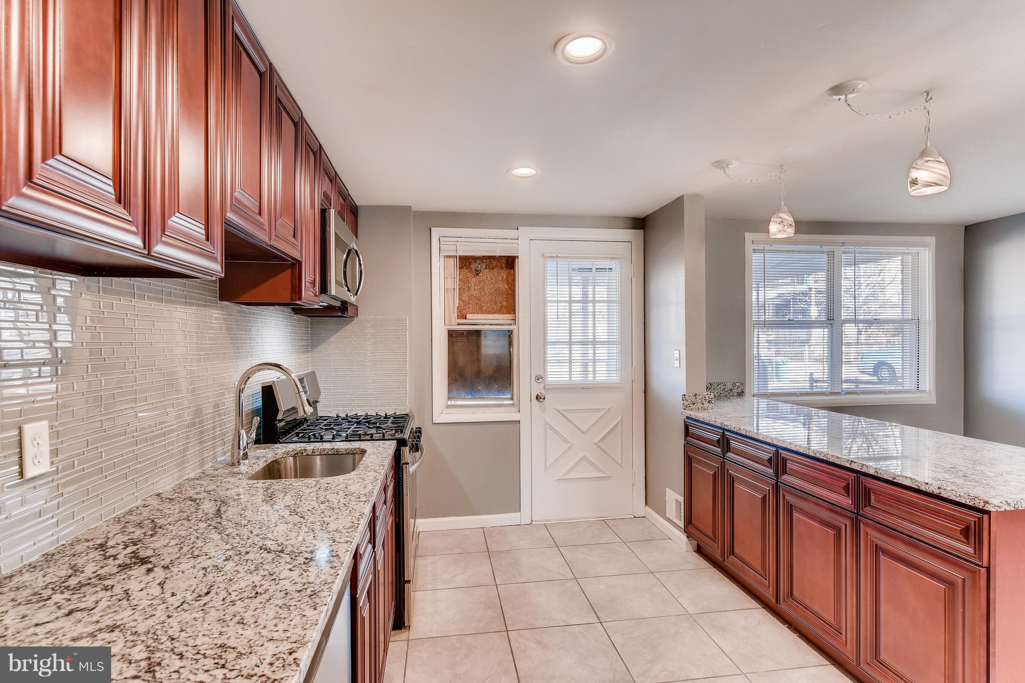 5505 Silverbell Road Baltimore, MD 21206 - Photo 7 of 21 Let there be light! Big windows, recessed lighting