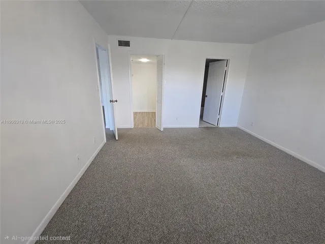 a view of a room with wooden cabinet